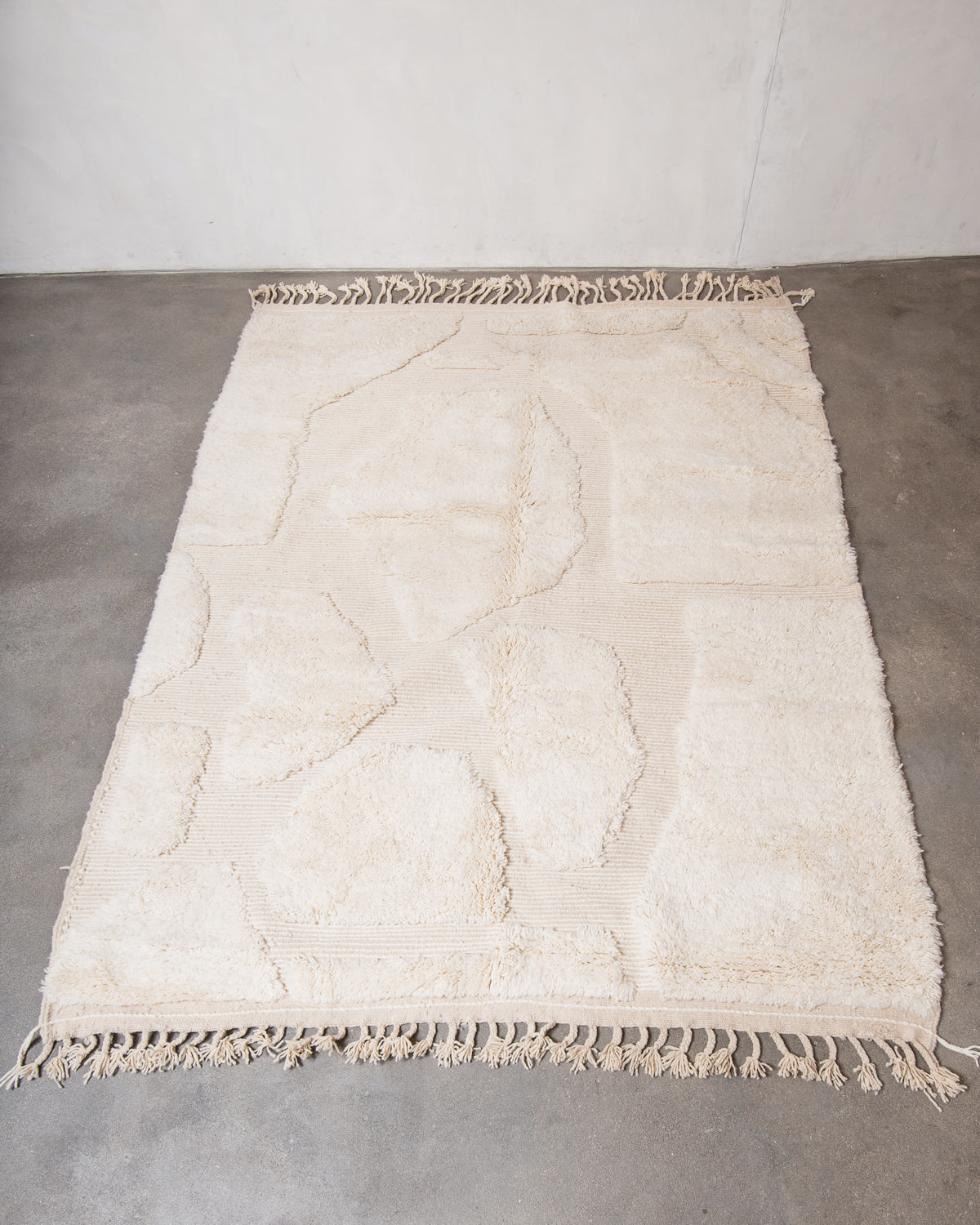 Modern, designer, handcrafted Berber rug from Morocco. Beniourain carpet with minimalist design, natural wool pile and a fluffy texture.
